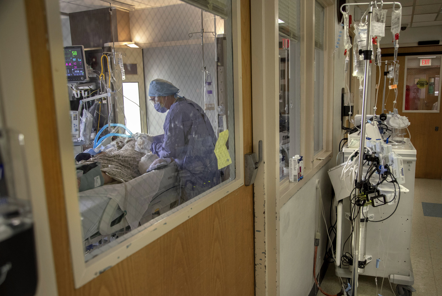 A nurse in the ICU cares for her patient at Holy Name Medical Center. 04/02/2020  Photo by Jeff Rhode