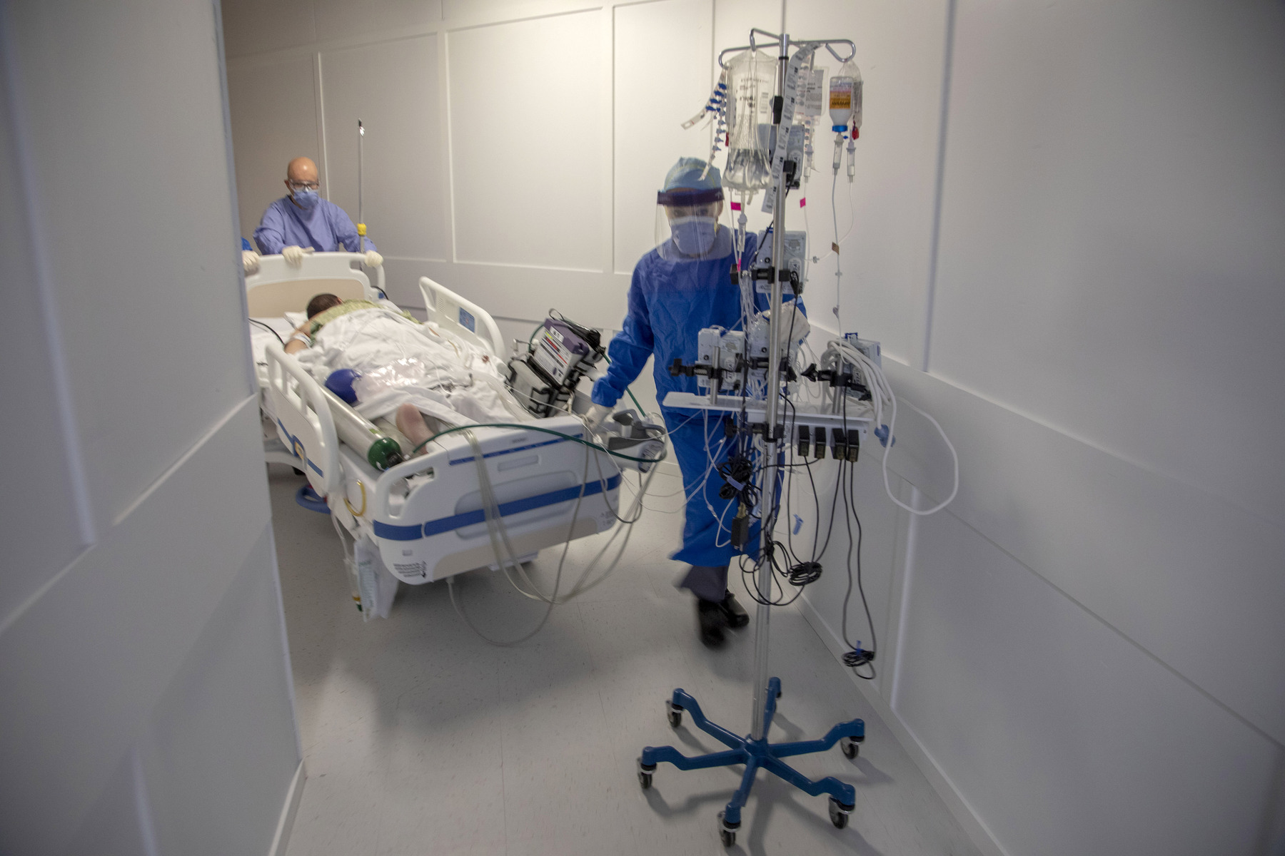 Patients are transported to a new ICU area built to cope with the growing number of COVID-19 patients. 4/2/2020 Photos by Jeff Rhode