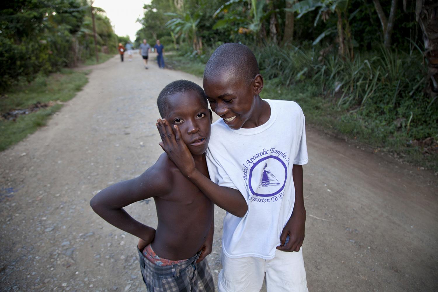 2 boys play on the street in Milot, Haiti.