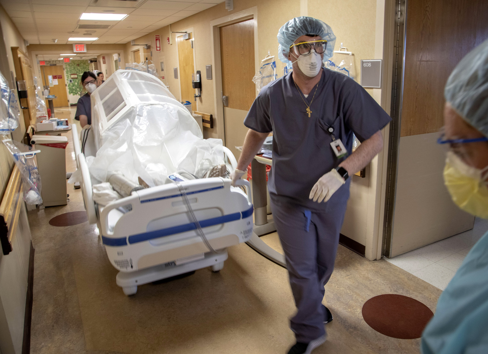 Stephen Cannon, RN, Transports a patient in Holy Name Medical Center in Teaneck, New Jersey, during the first few days of the COVID-19 Pandemic. 03/19/2020.  Photos by Jeff Rhode/Holy Name Medical Center