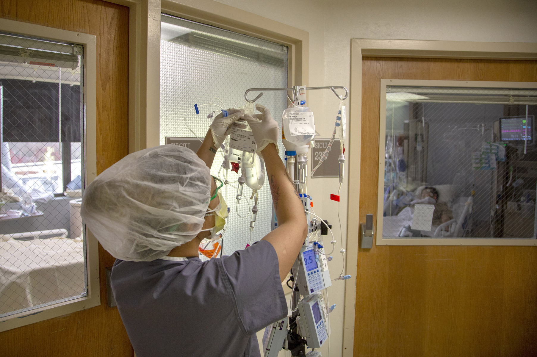 AN ICU nurse hangs medication on an IV pole during the first days of the COVID-19 Pandemic at Holy Name Medical Center in Teaneck, New Jersey. 03/19/2020. Photo by Jeff Rhode/Holy Name Medical Center
